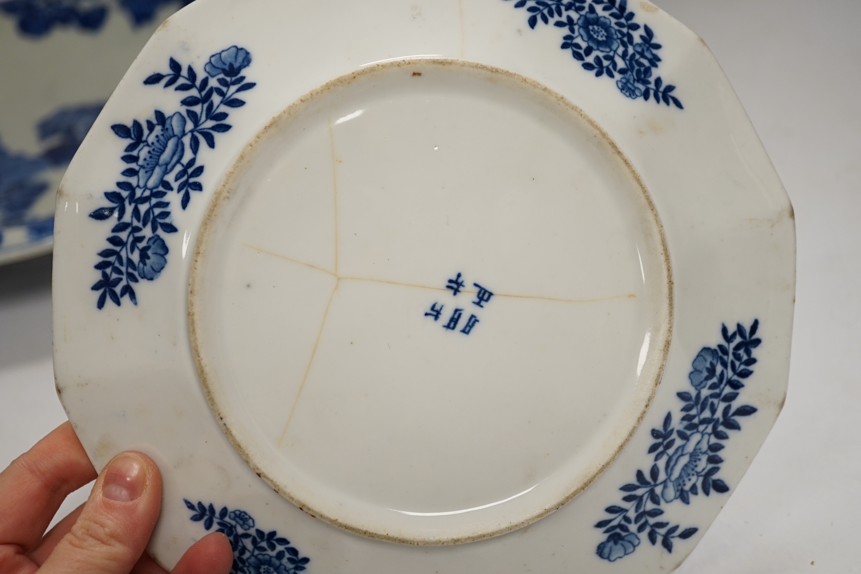 Assorted Chinese and Japanese ceramics comprising a famille rose bowl, two blue and white plates and a blue and white bowl, largest 30cm in diameter